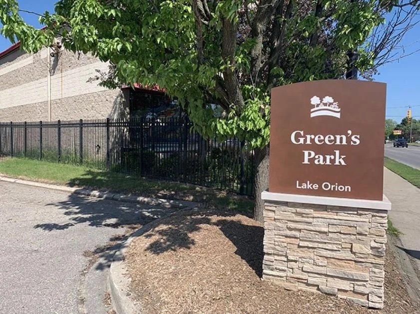 The Green's Park sign at the entrance in Lake Orion